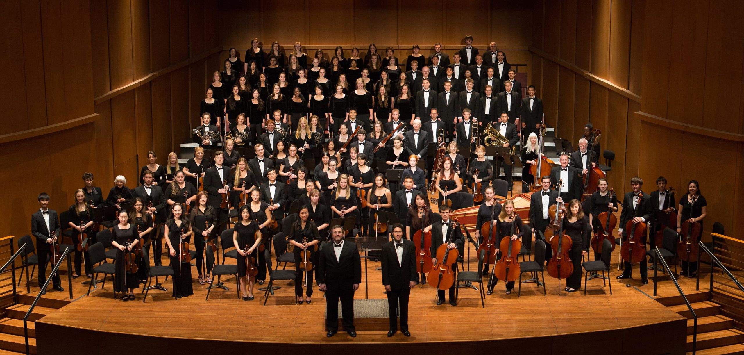 Claremont Concert Orchestra - Image of the orchestra standing on the stage at Garrison Theater at Scripps College